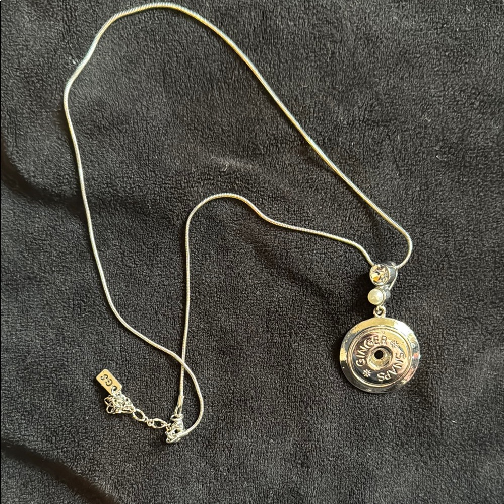 Intricate Silver Necklace with Round Pendant